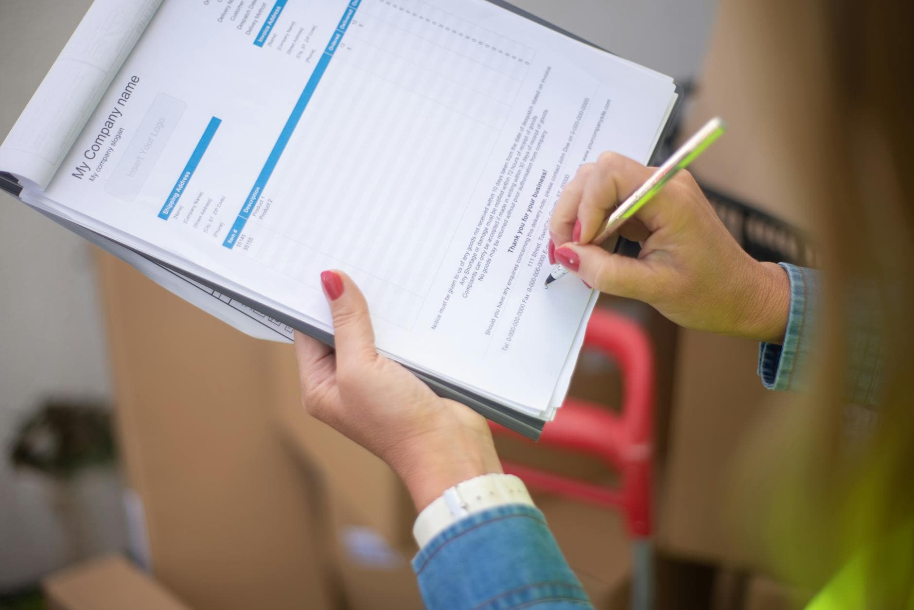 Close-up of woman's hand signing a document on a clipboard. Ideal for business and legal themes. - emotional validation definition