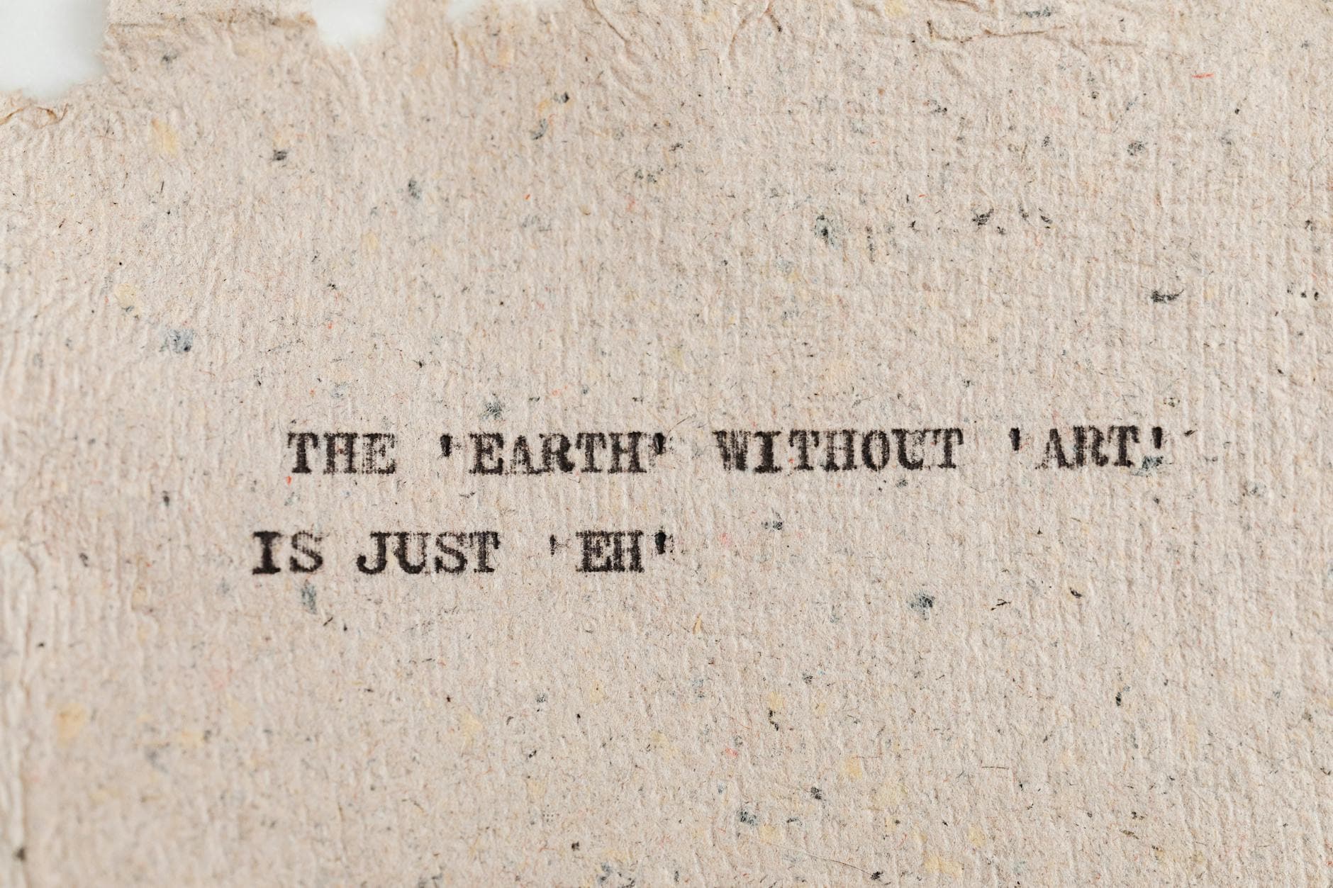 Textured paper with motivational quote highlighting art's importance. - empty nest quotes