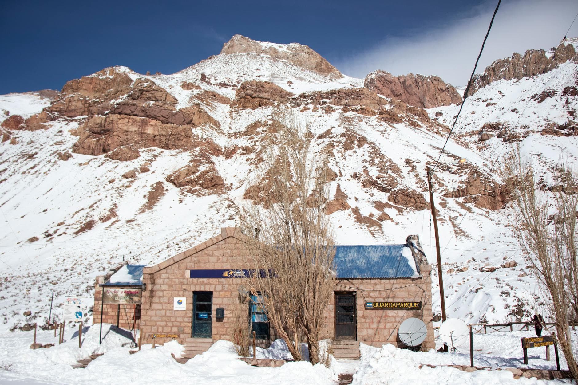 Winter scene of a post office in Los Penitentes, Mendoza, Argentina, with snow-covered mountains. - nature for post-winter blues