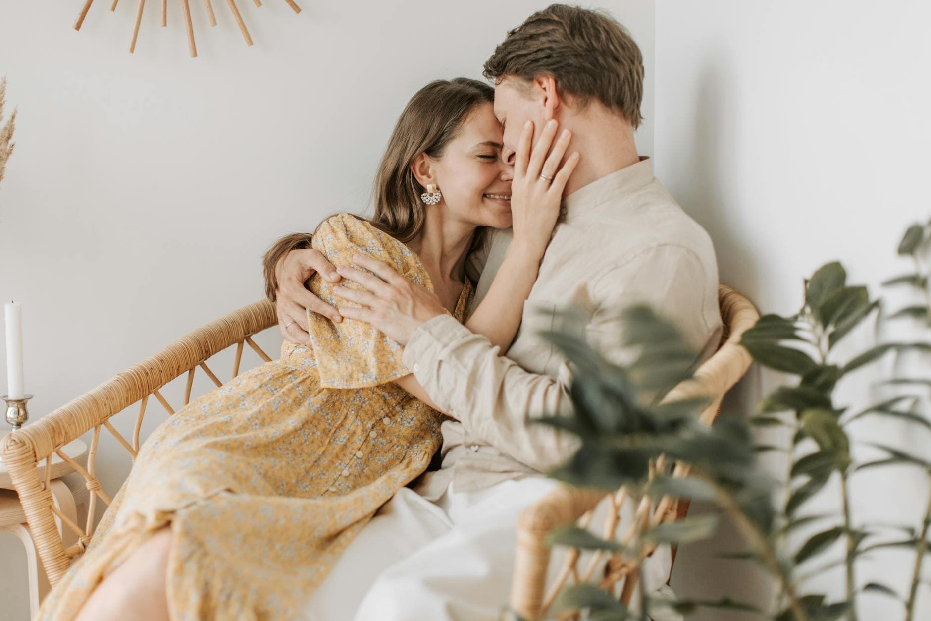 A loving couple sitting closely, sharing a tender moment in a cozy indoor setting. - secure attachment style