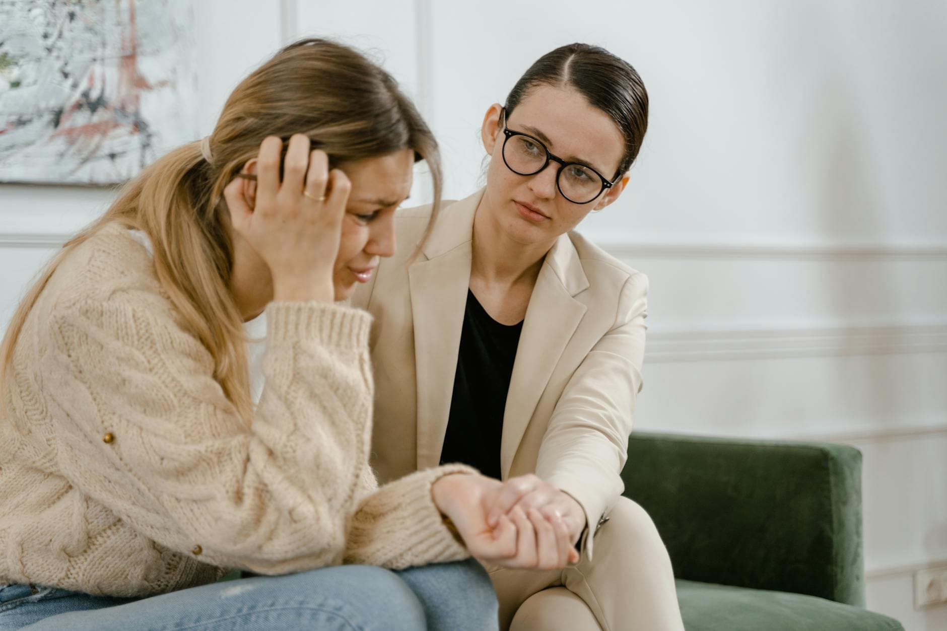 A woman receives counseling from a professional, showcasing empathy and mental health support. - spring anxiety help