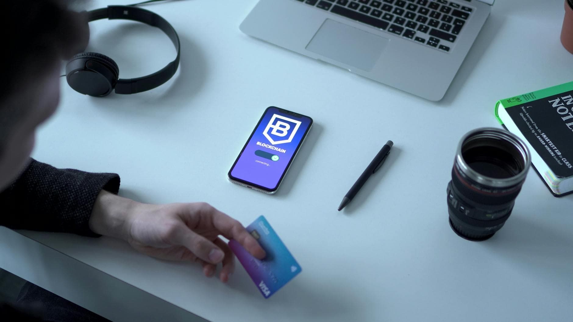 Person holding credit card by digital currency app, exploring blockchain technology. - spring dating app