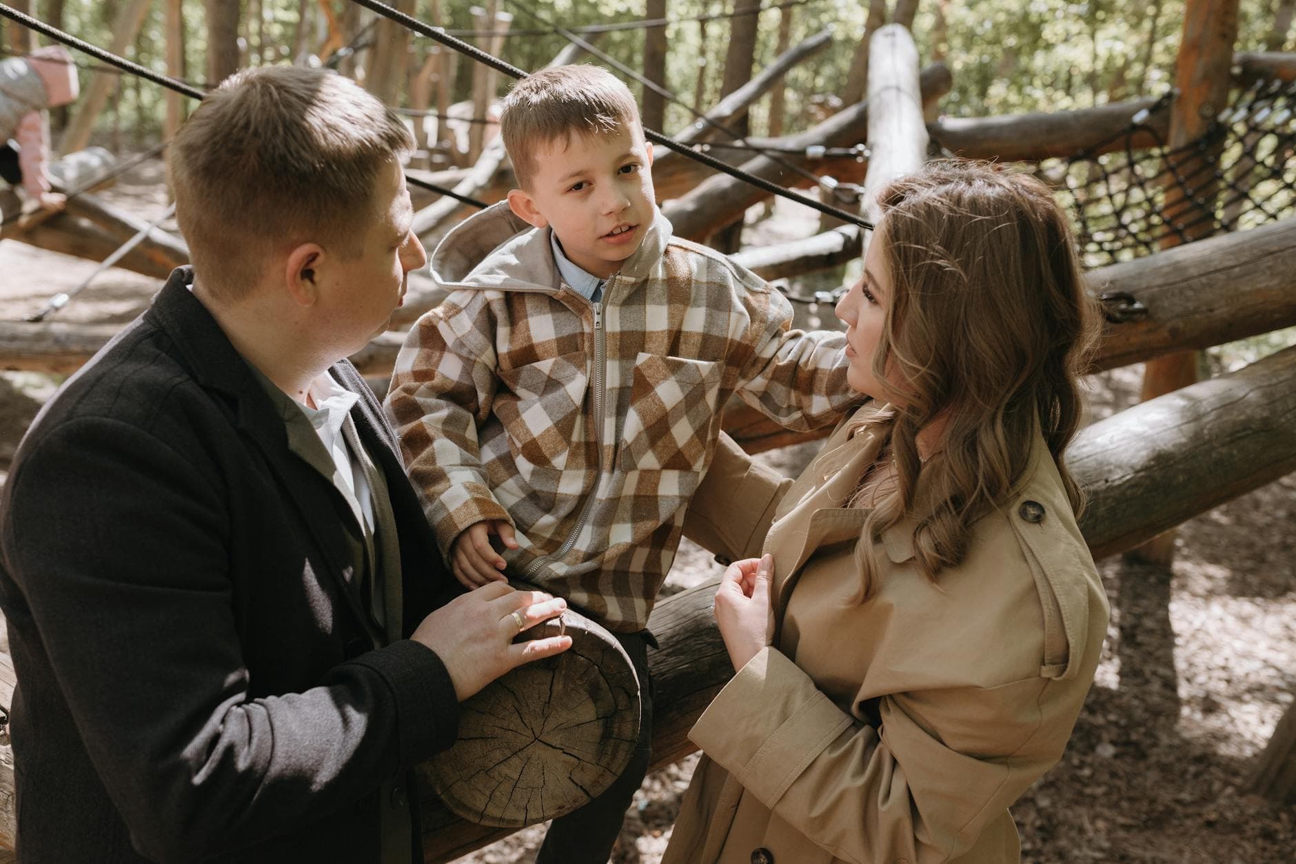 Family enjoying time at an outdoor park, engaging and playful. - active listening parents