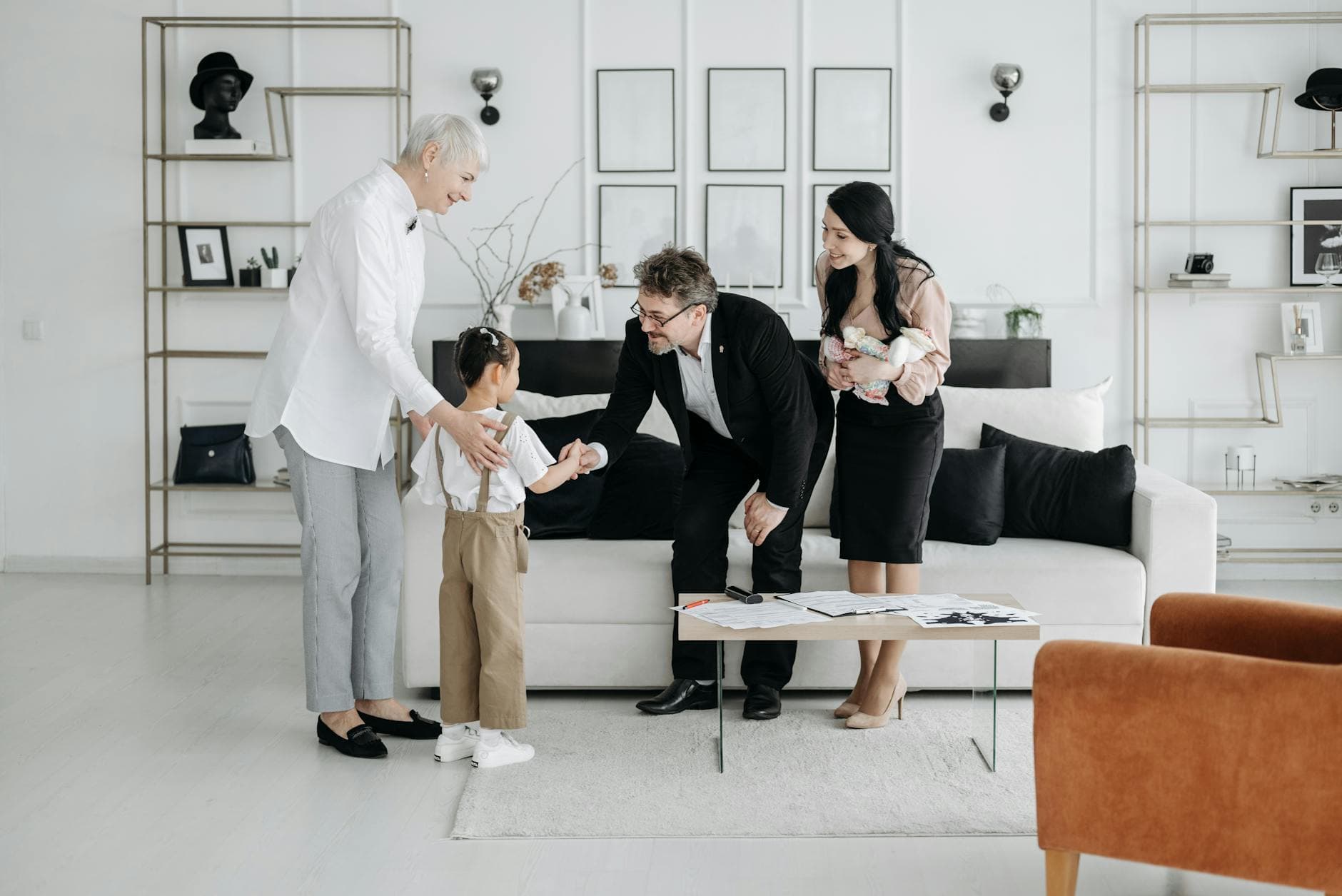 A welcoming family scene involving adults and children indoors, showcasing connection and warmth. - family communication skills