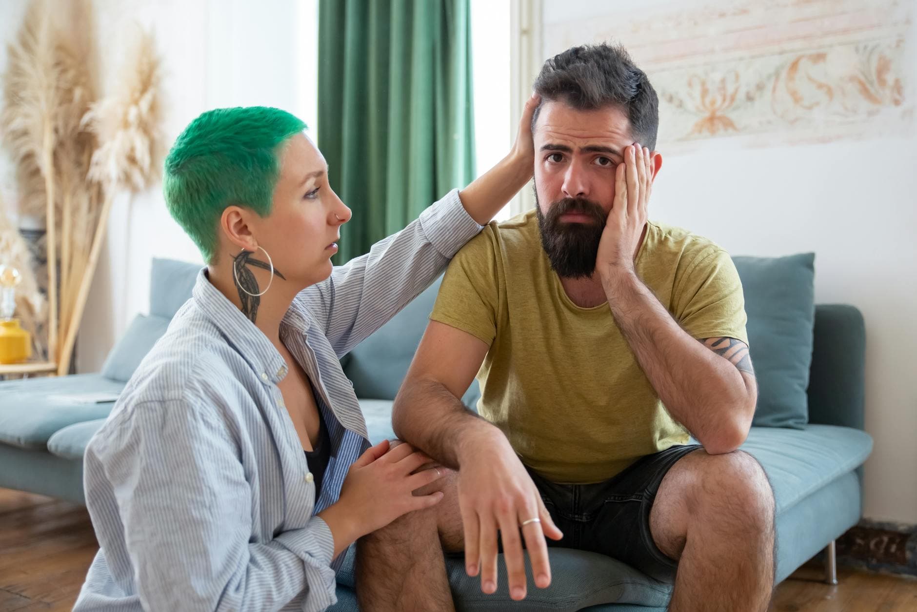 A couple shares an emotional exchange at home, offering comfort and support. - green flags relationship