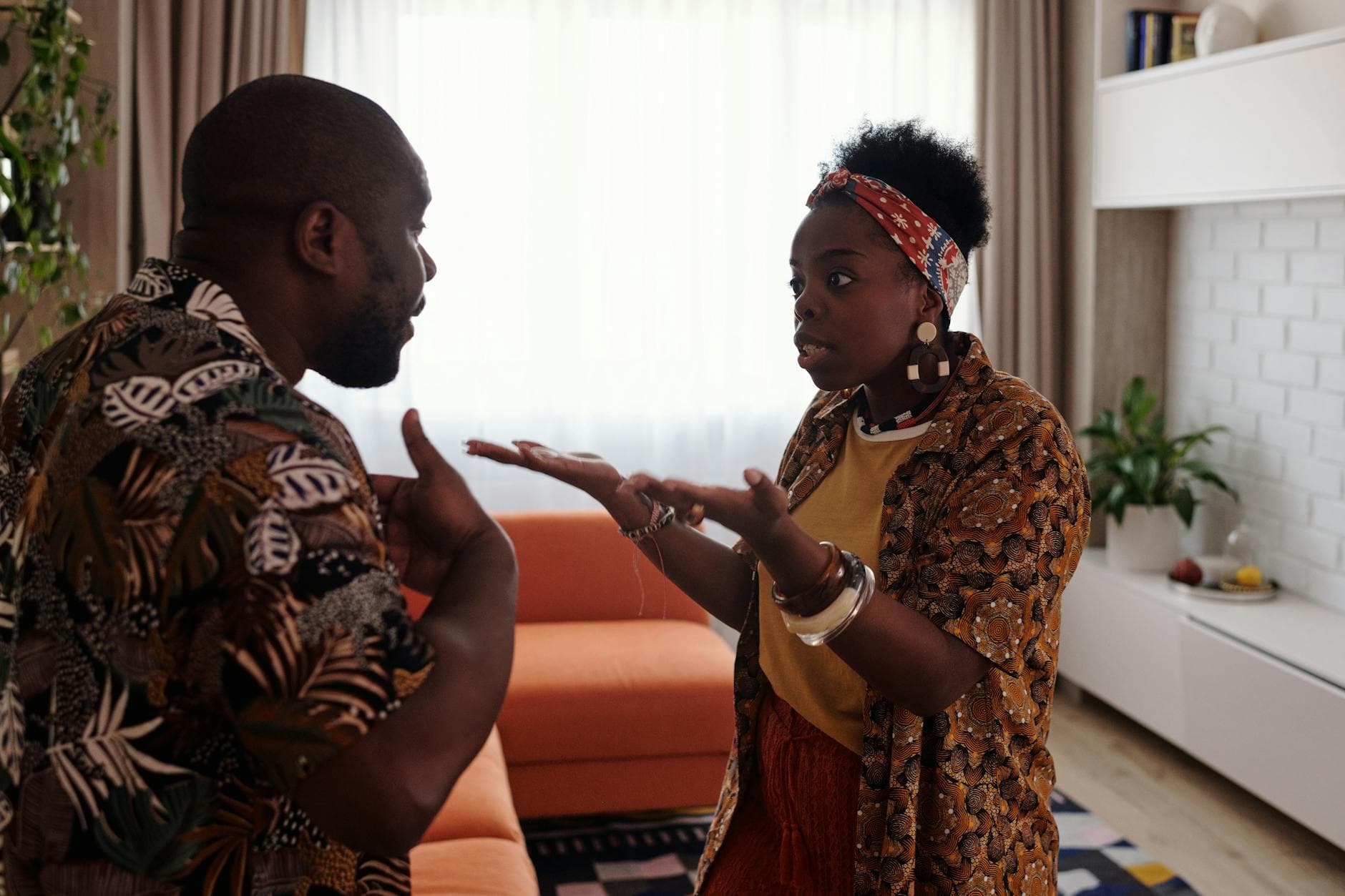 A couple arguing passionately in their living room, expressing emotions and gestures. - conflict resolution worksheet