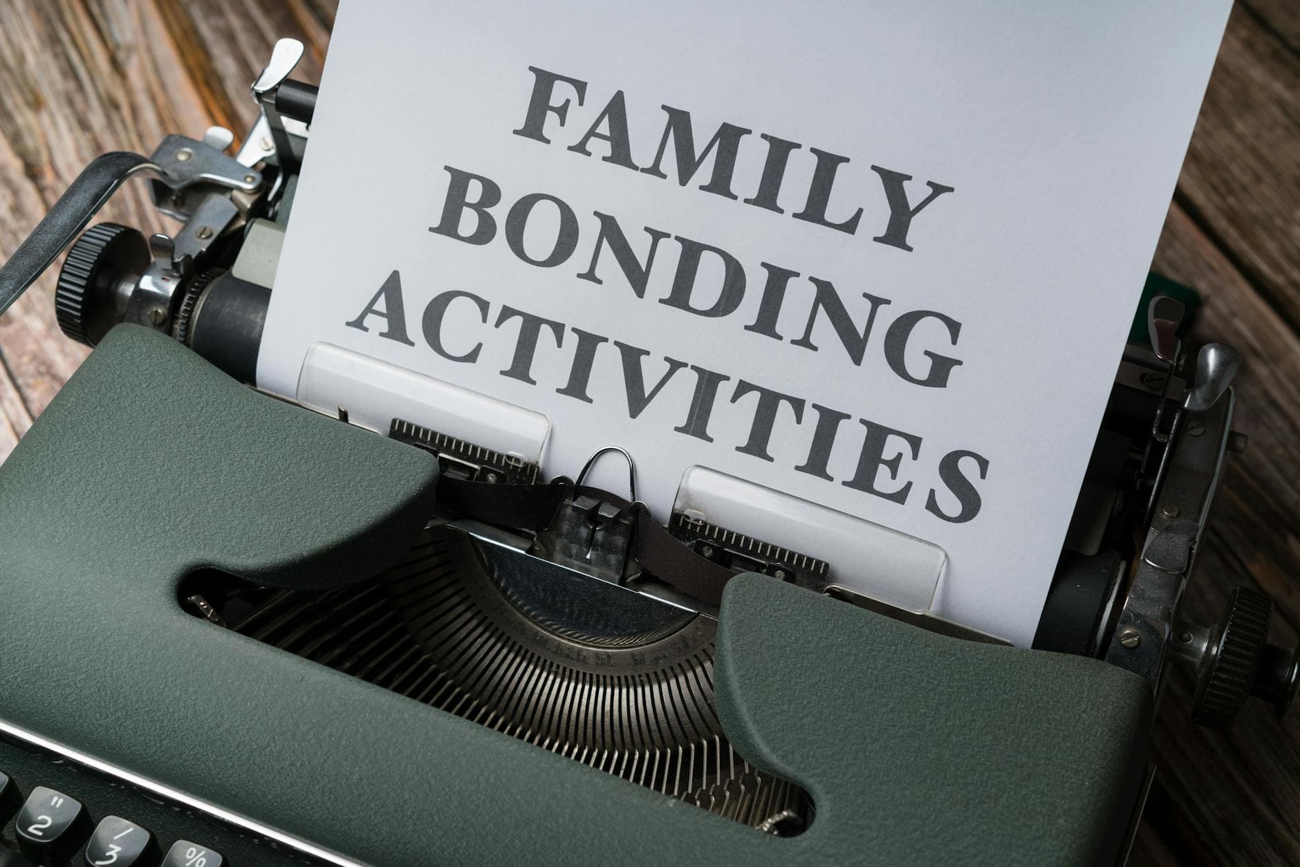 Close-up of a vintage typewriter with a paper showing the text 'Family Bonding Activities.' - family communication tips
