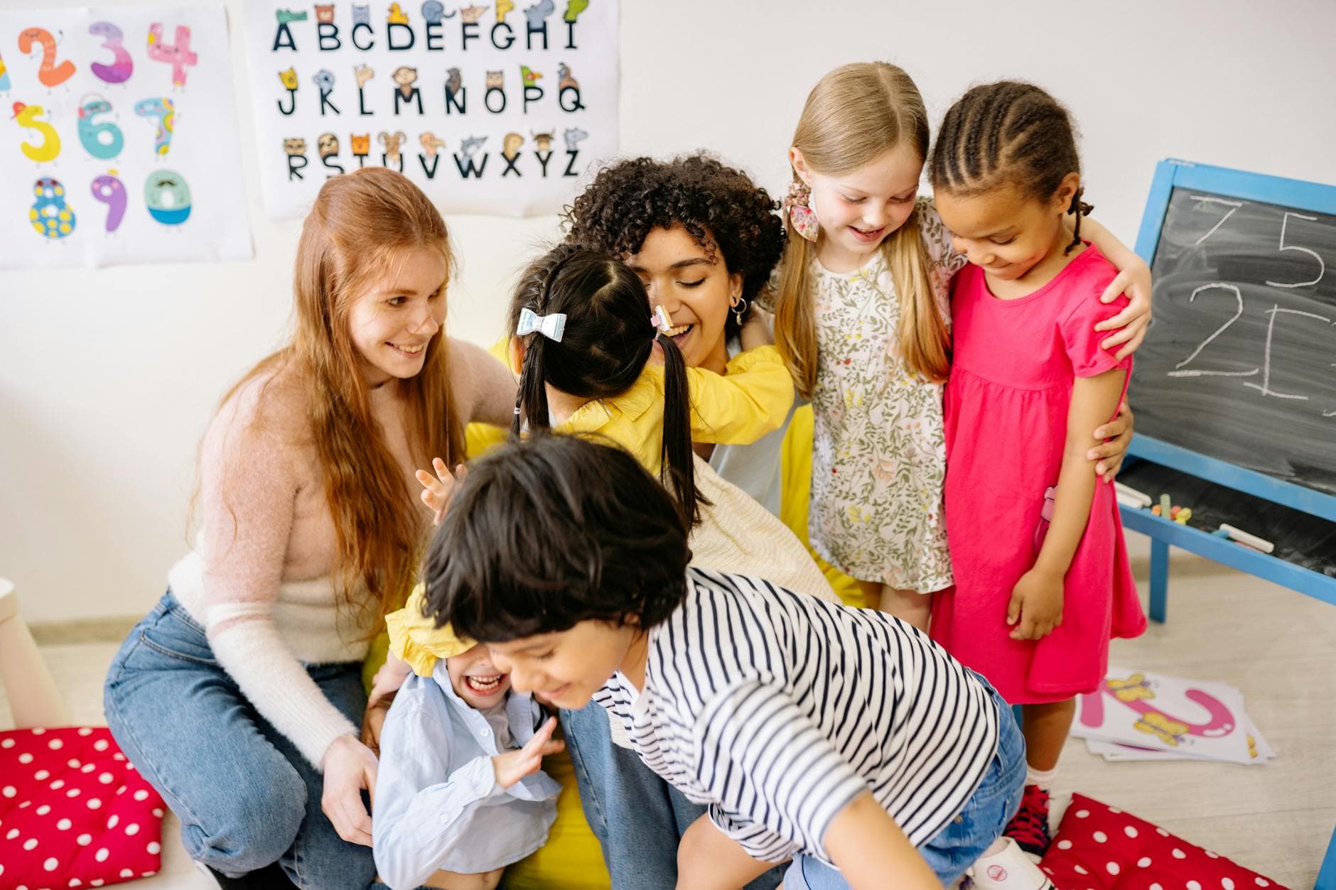 Happy preschoolers and teacher bonding in a colorful classroom setting, fostering friendship and education. - preschool sharing activities