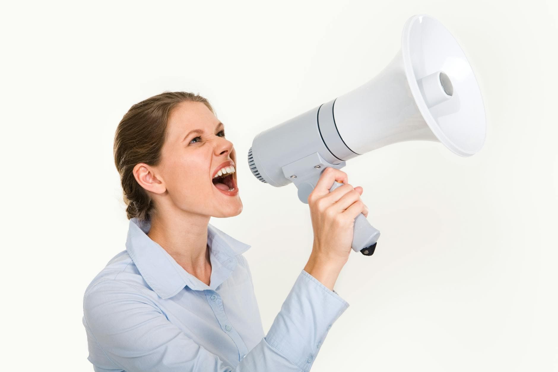 Energetic young woman shouting through a megaphone, expressing enthusiasm and leadership on a white background. - cbt for clarity