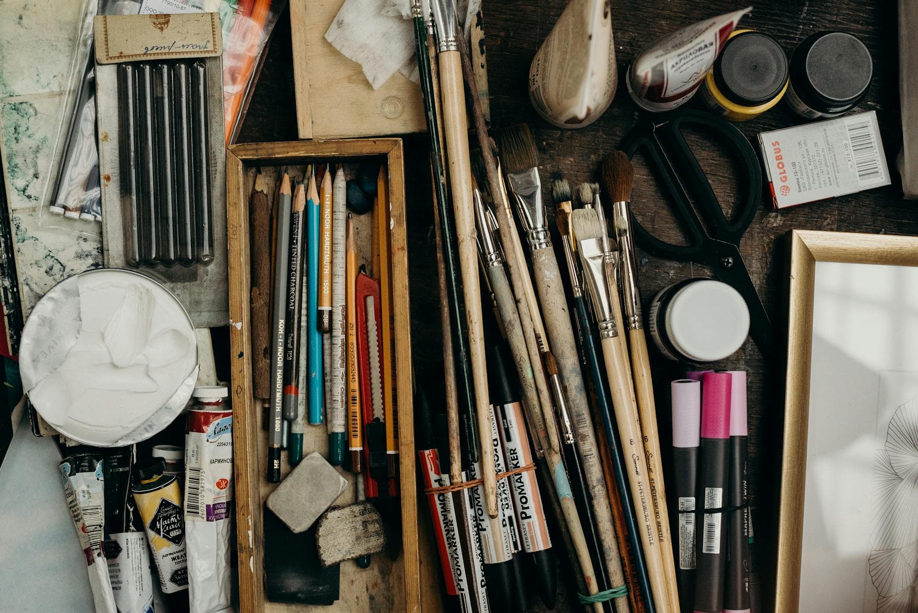 Top view of various art supplies on a desk, showcasing creativity tools. - clear mental clutter