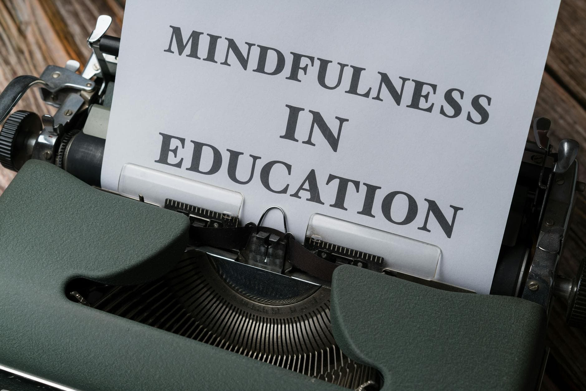 Close-up of a vintage typewriter with 'Mindfulness in Education' paper. - spring mindfulness practices