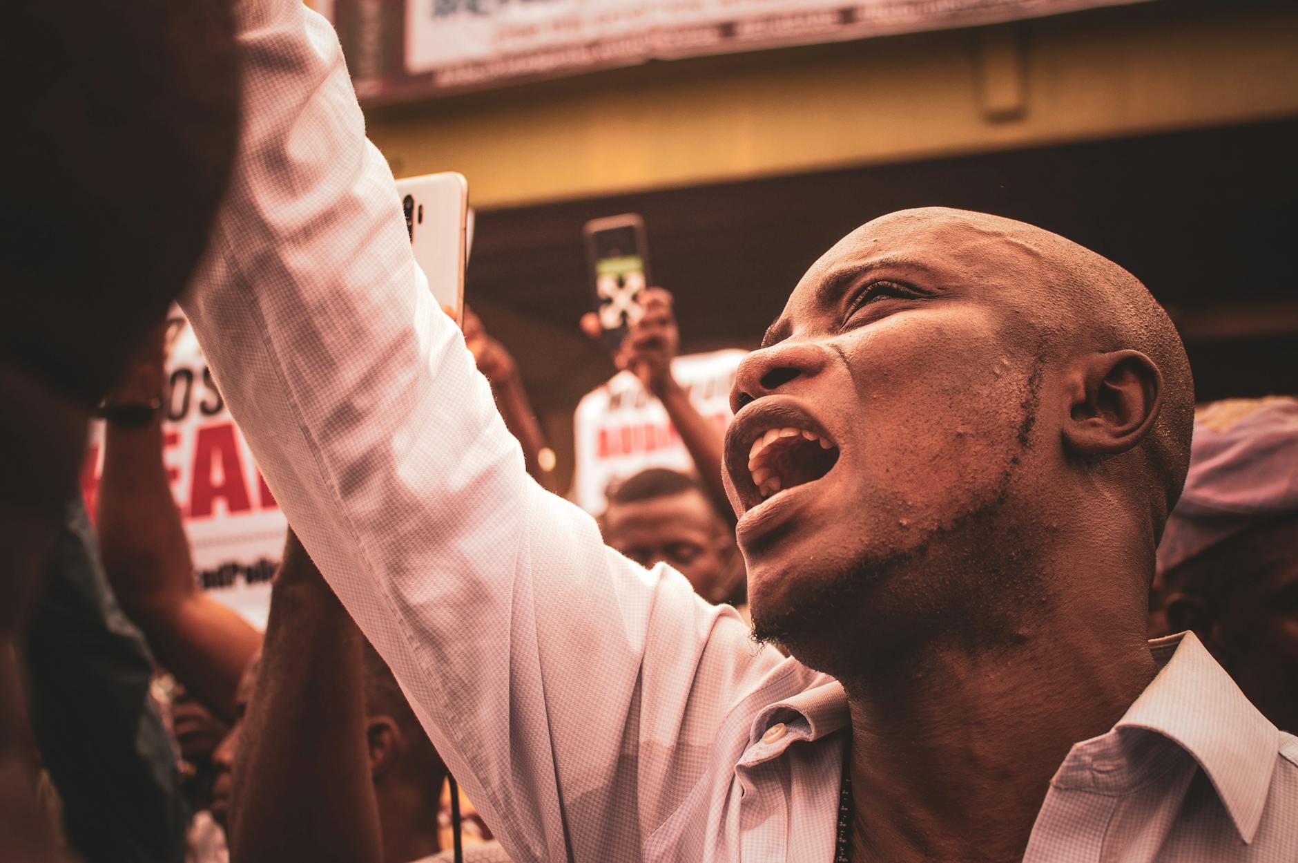 An engaged protestor shouting during a street demonstration, highlighting activism. - assertive communication in conflict