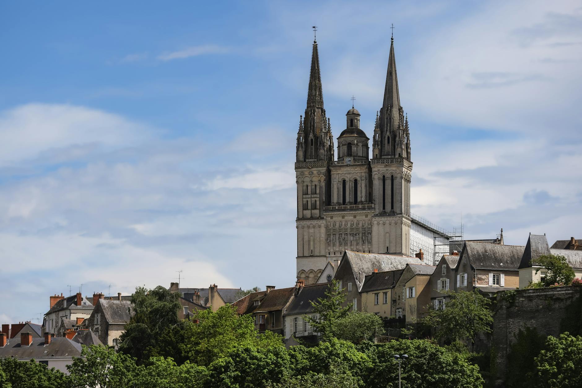 Angers Cathedral's towering spires under a vibrant sky in Pays de la Loire, France. - celebrity anger management lessons