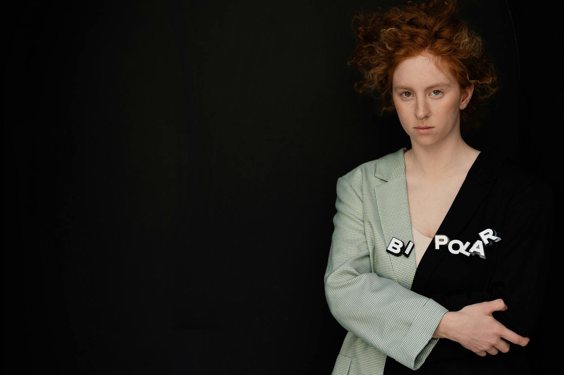 Artistic portrait of a woman with 'bipolar' text, expressing inner emotions and mental health themes. - charlie sheen mental health struggles