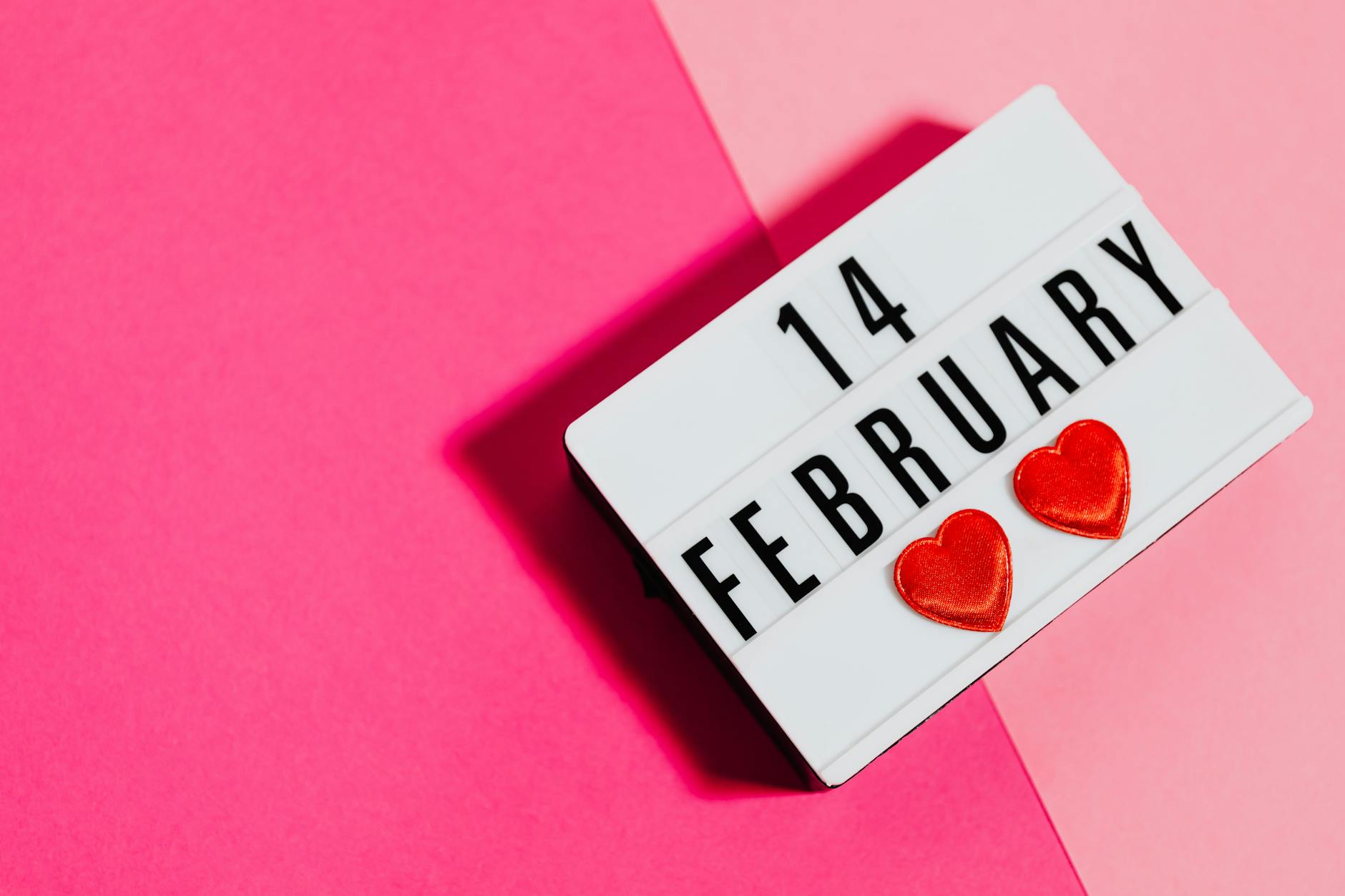 Lightbox display showing '14 February' with hearts on pink background. - at home date ideas february