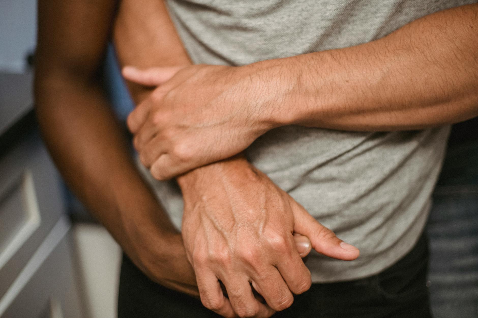 Close-up of two people holding hands, symbolizing love and connection. - rebuild trust in relationship