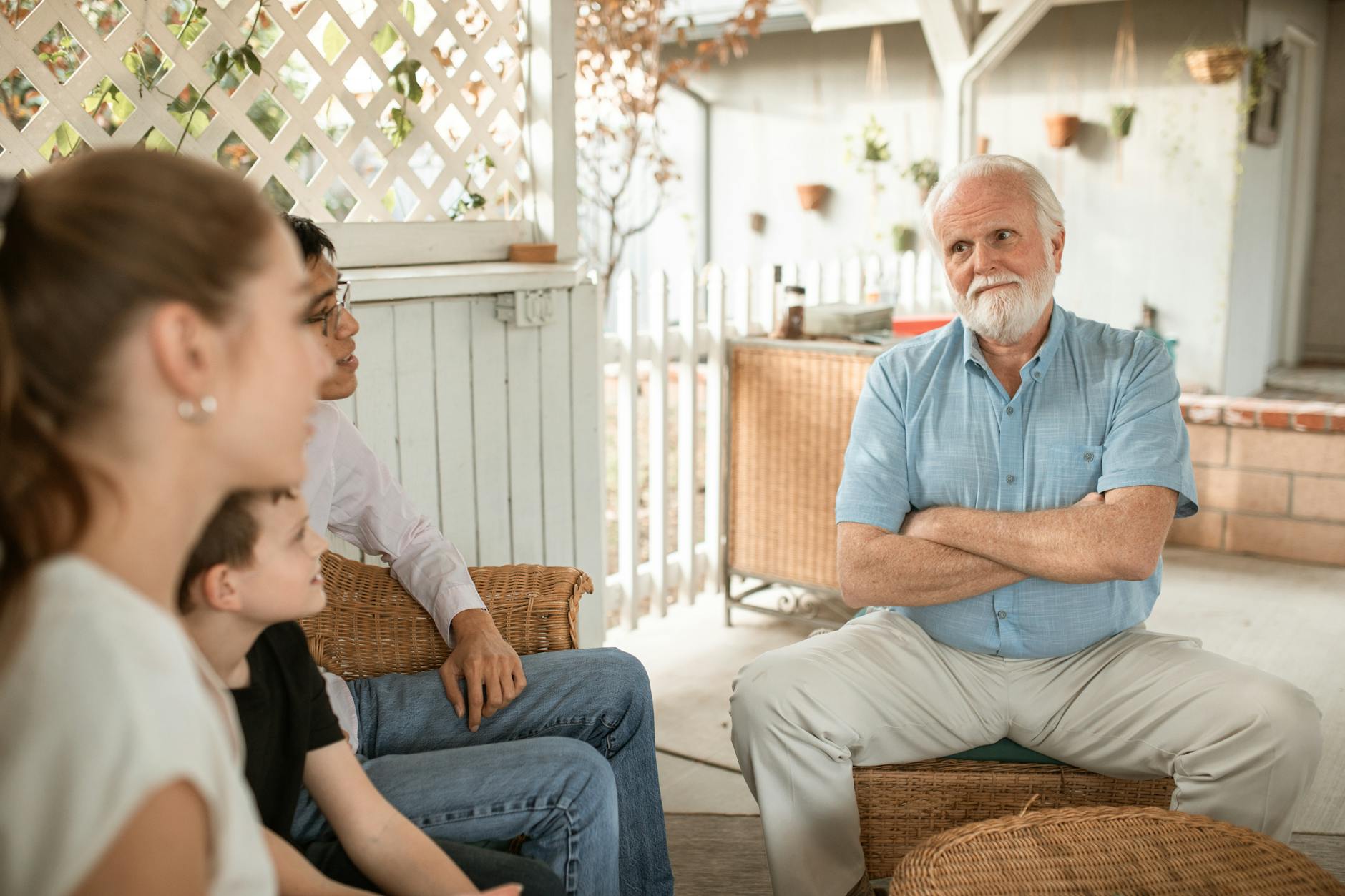 Family gathered indoors, engaged in conversation with a focus on bonds and togetherness. - setting boundaries family gatherings