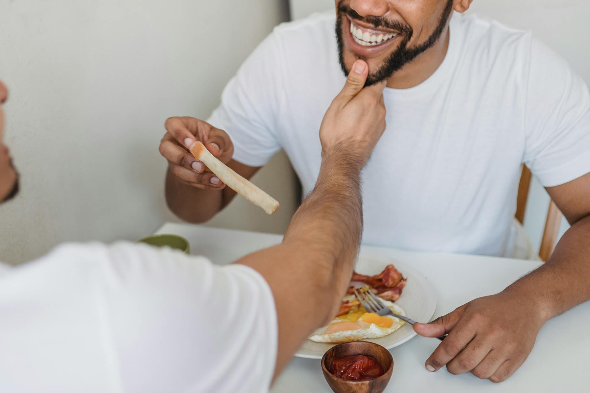 An intimate moment of a couple enjoying breakfast together, highlighting love and connection. - setting relationship boundaries