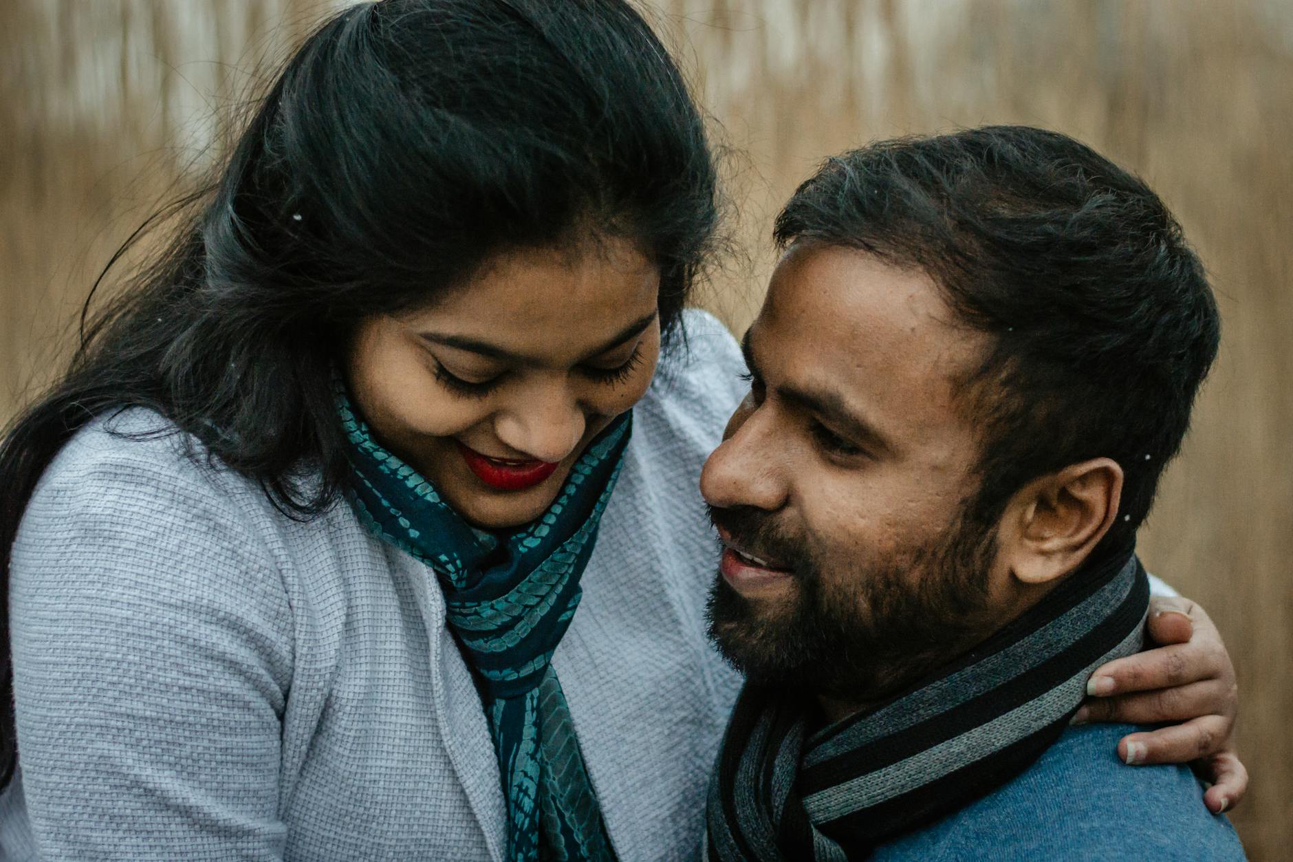 A couple sharing a tender moment outdoors, showcasing love and affection. - support partner winter blues