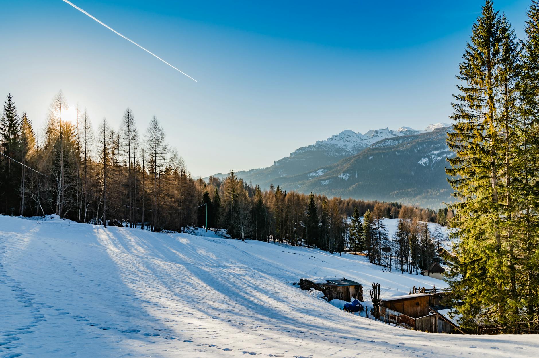 Idyllic winter scene in Cortina d'Ampezzo with snowy mountains and pine trees. - winter blues natural remedies
