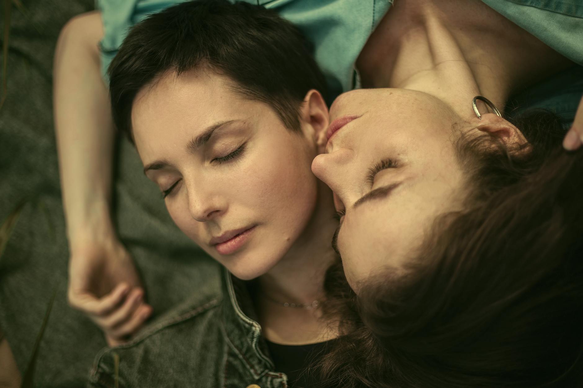 A serene image of a couple lying together, embodying love and intimacy. - winter proximity attachment styles