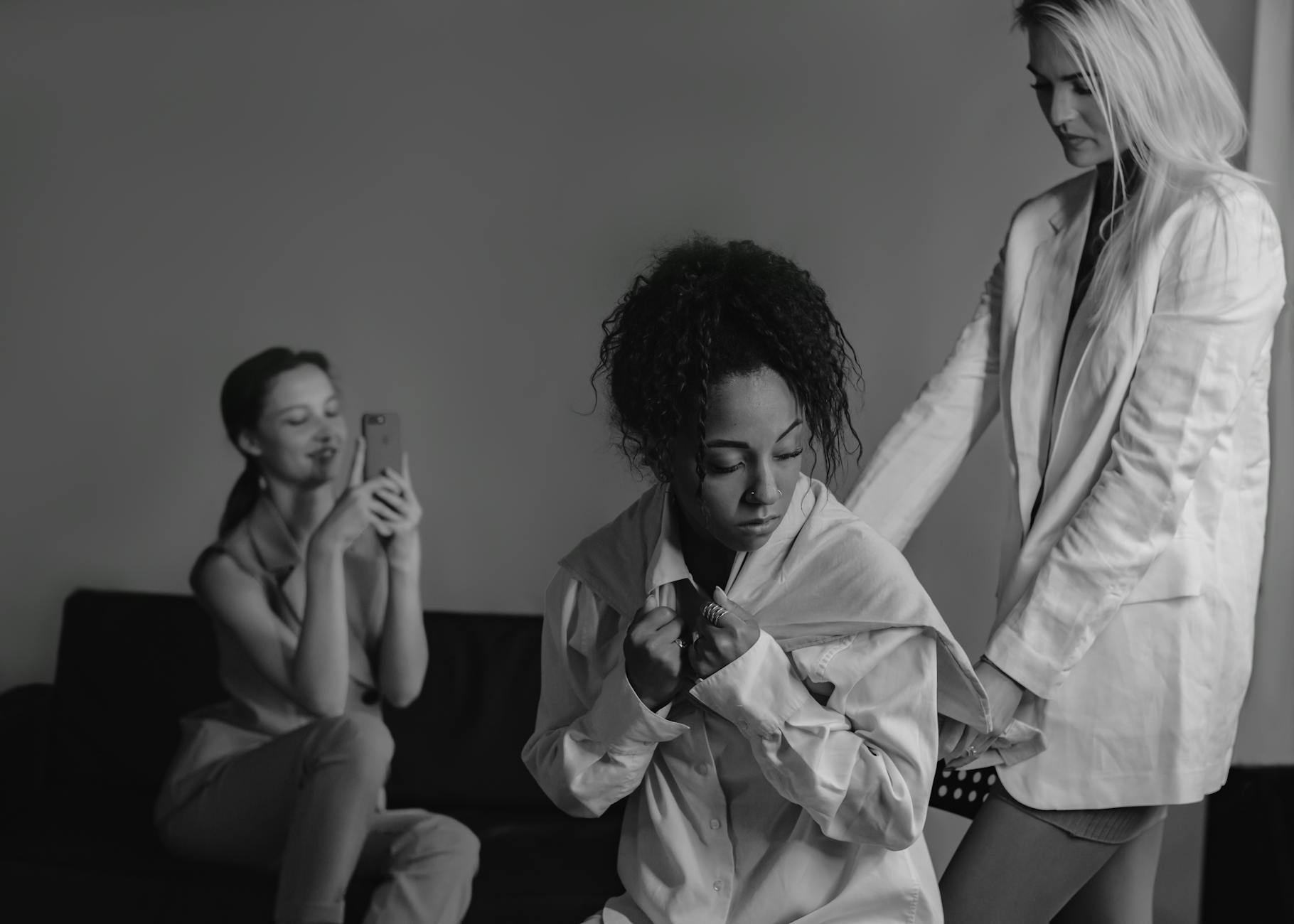 Monochrome image depicting a stressful workplace moment between colleagues - workplace conflict resolution the office