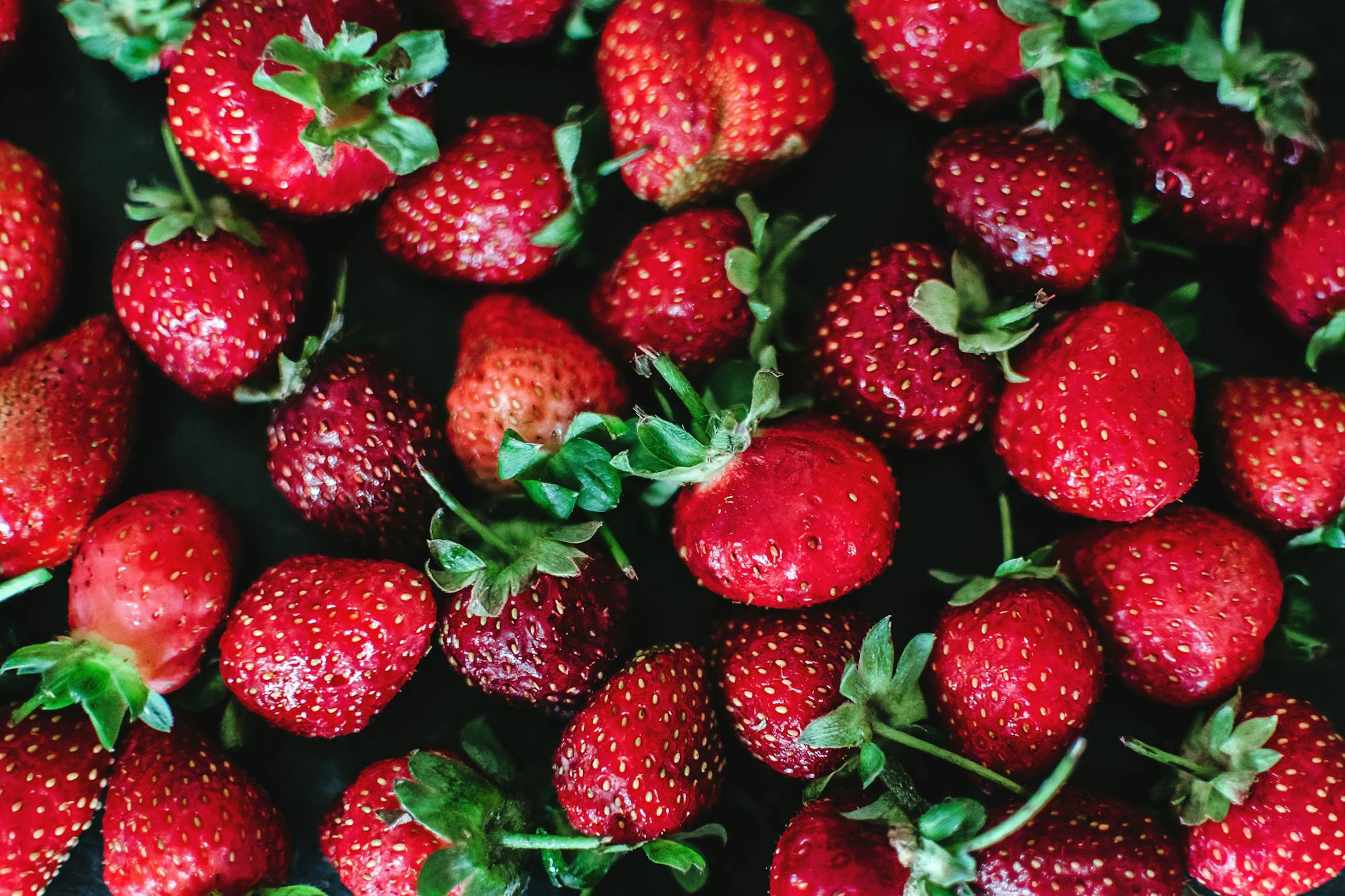Vibrant fresh red strawberries showcasing texture and freshness in a close-up shot. - allergies mood focus