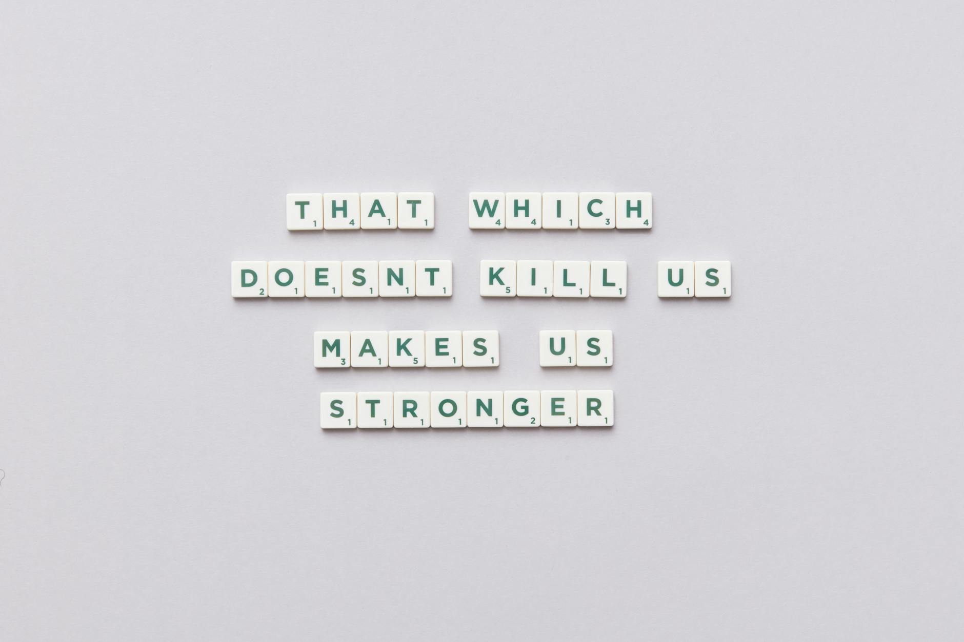 Inspirational quote using Scrabble tiles on a light background, perfect for motivational content. - build resilience