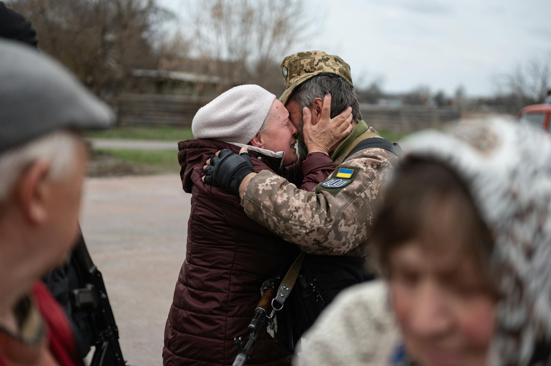 Heartfelt embrace in Makariv, Ukraine, capturing the emotional reunion. - couples spring reconnection
