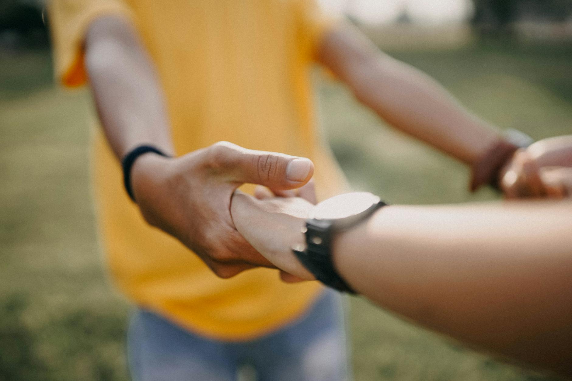 Intimate close-up of a couple holding hands, symbolizing love and togetherness. - express gratitude partner