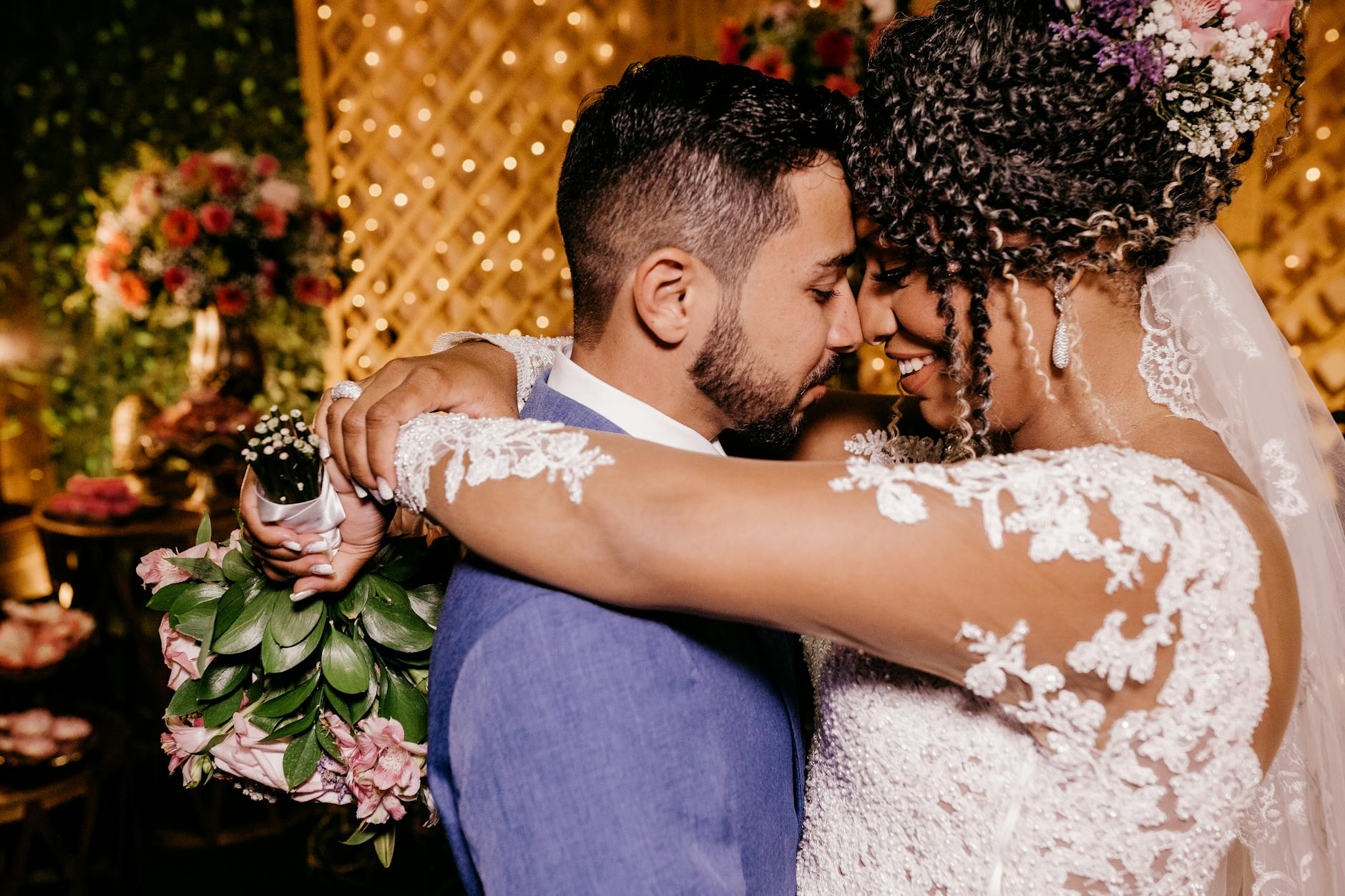 Romantic moment of bride and groom embracing indoors at their wedding ceremony. - gratitude in marriage