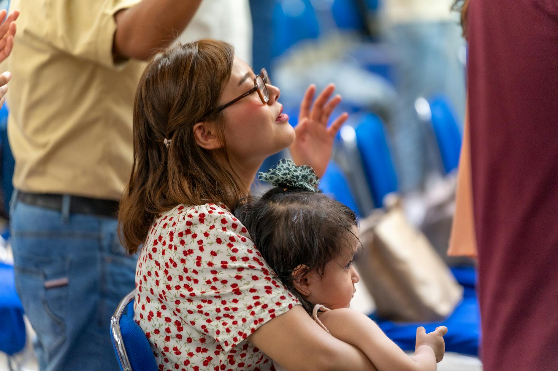 A woman and her child participate in a religious service in Mexico City. - gratitude practices winter