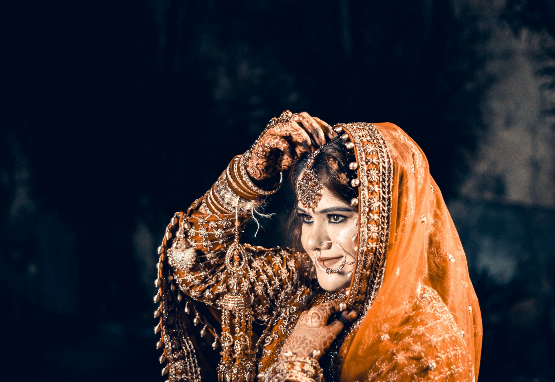 A beautiful Indian bride adorned in traditional wedding attire with intricate jewelry in Ahmedabad, India. - marriage advice bride