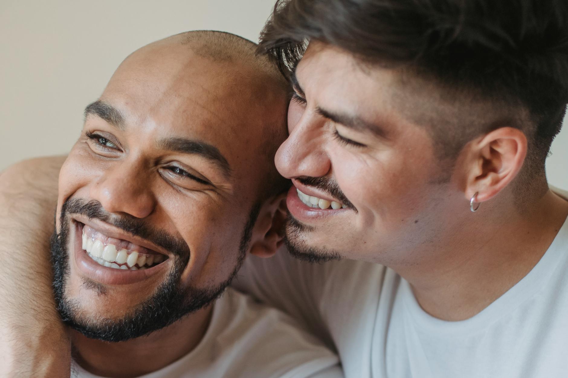 Close-up of a joyful couple embracing and sharing a genuine moment of happiness. - marriage advice men
