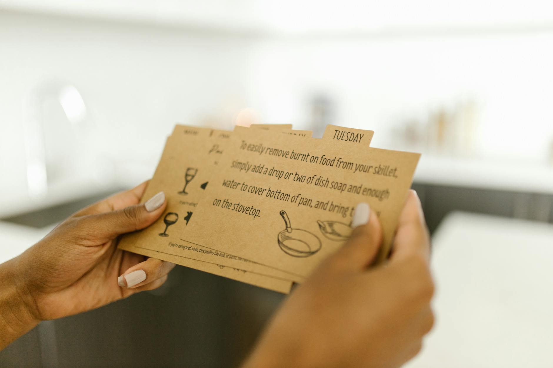 Woman holding instructional cards with text and illustrations. - marriage maintenance tips