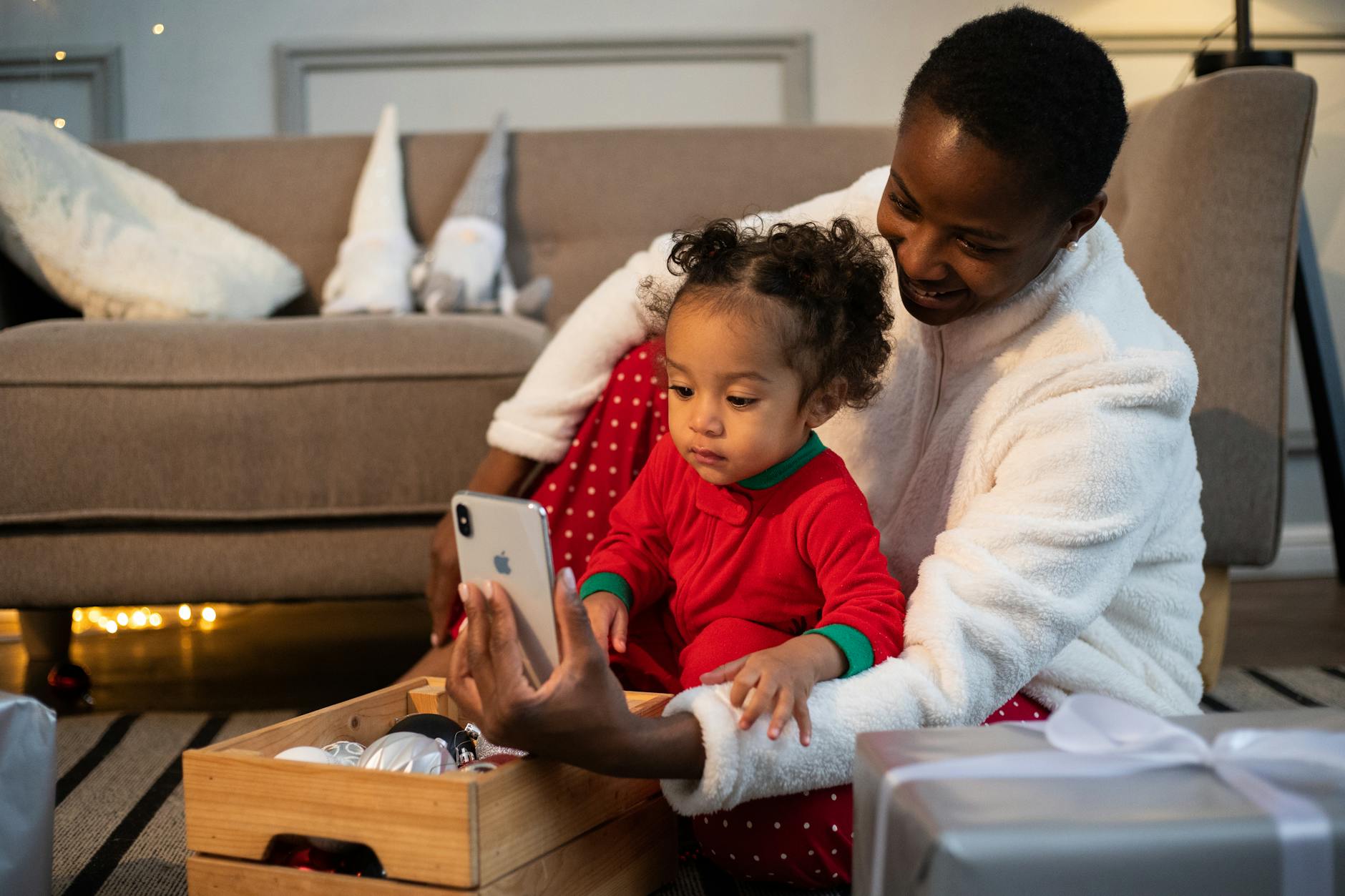 Mother and child in pajamas enjoying a video call during holiday season indoors. - post holiday family talk