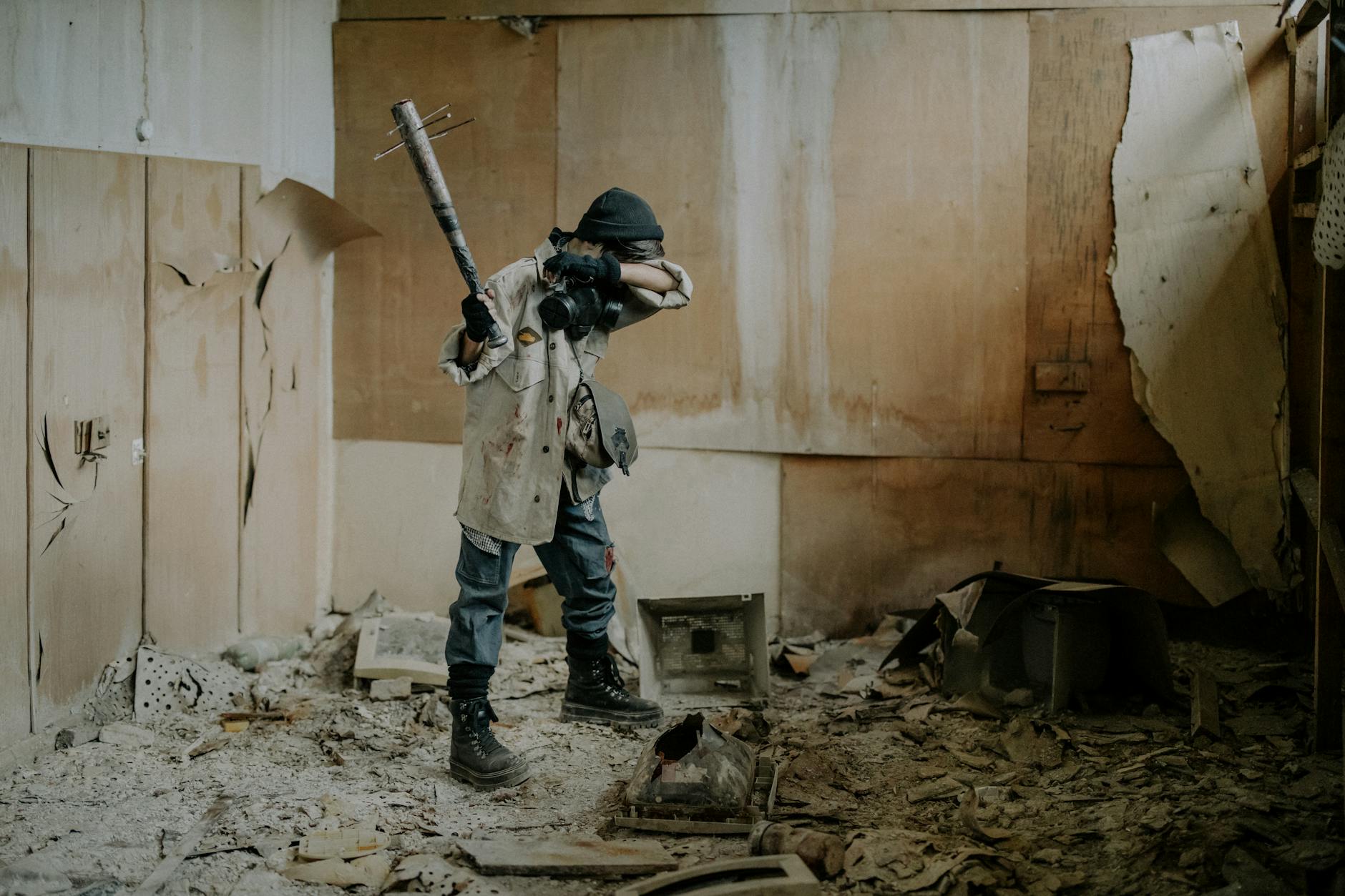 A dramatic post-apocalyptic scene with a masked figure holding a weapon in a dilapidated room. - post winter break routine