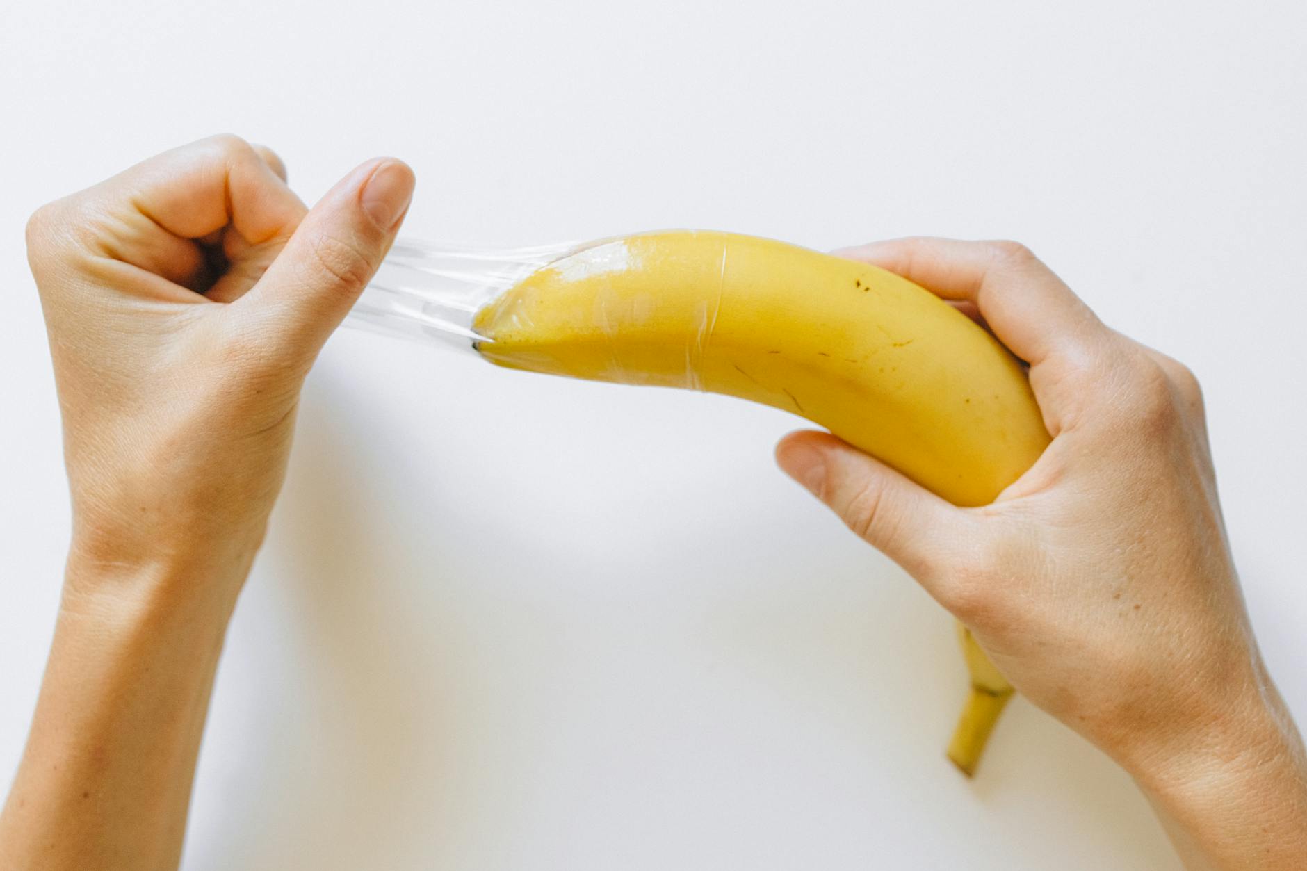 A conceptual image showing a banana with a condom to illustrate safe sex practices. - prevent spring s.a.d.