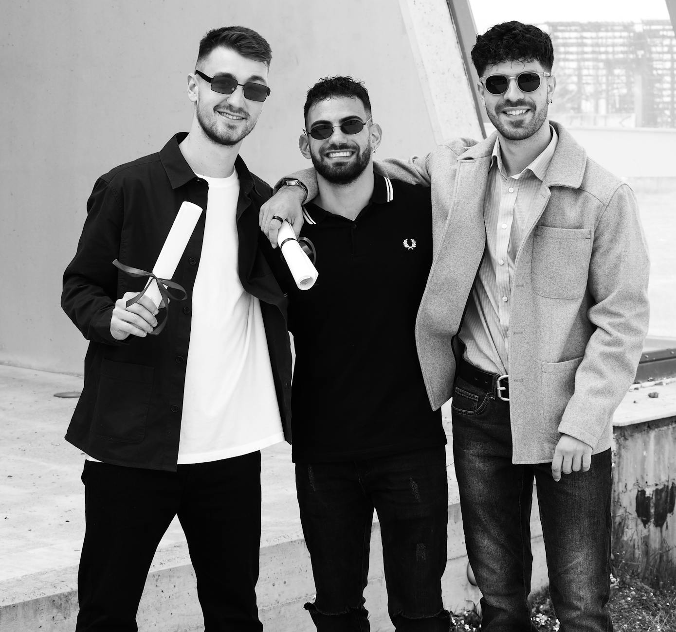 Three friends in sunglasses posing and smiling while holding diplomas outdoors. - rekindle intimacy in relationship