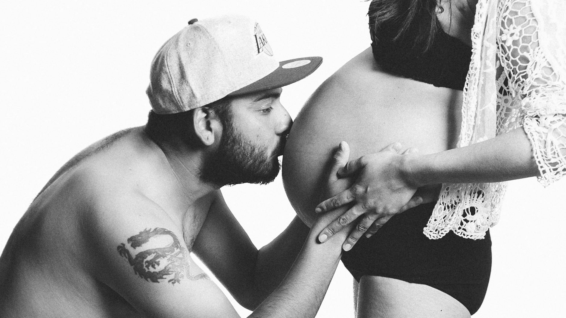 A couple sharing an intimate moment during pregnancy, highlighting love and parenthood. - reset relationship expectations
