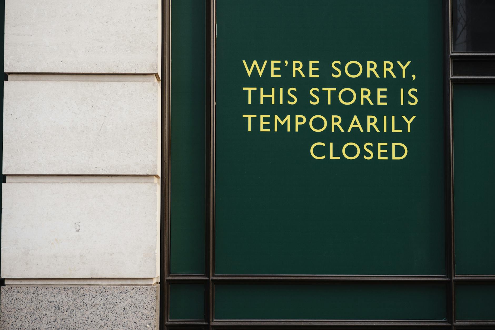 A photo of a store facade with a sign indicating temporary closure due to unforeseen circumstances. - school closure activities