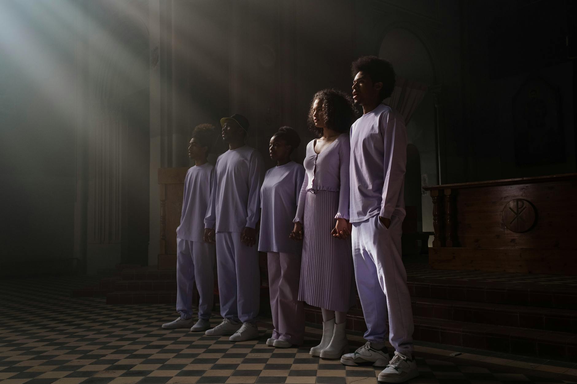 A group of five adults in a church choir singing under a sunbeam, showcasing harmony and faith. - self compassion practices