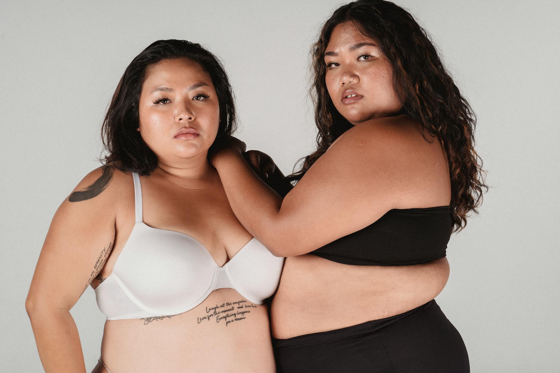Confident plus size women embracing body positivity in a studio setting. - self compassion spring