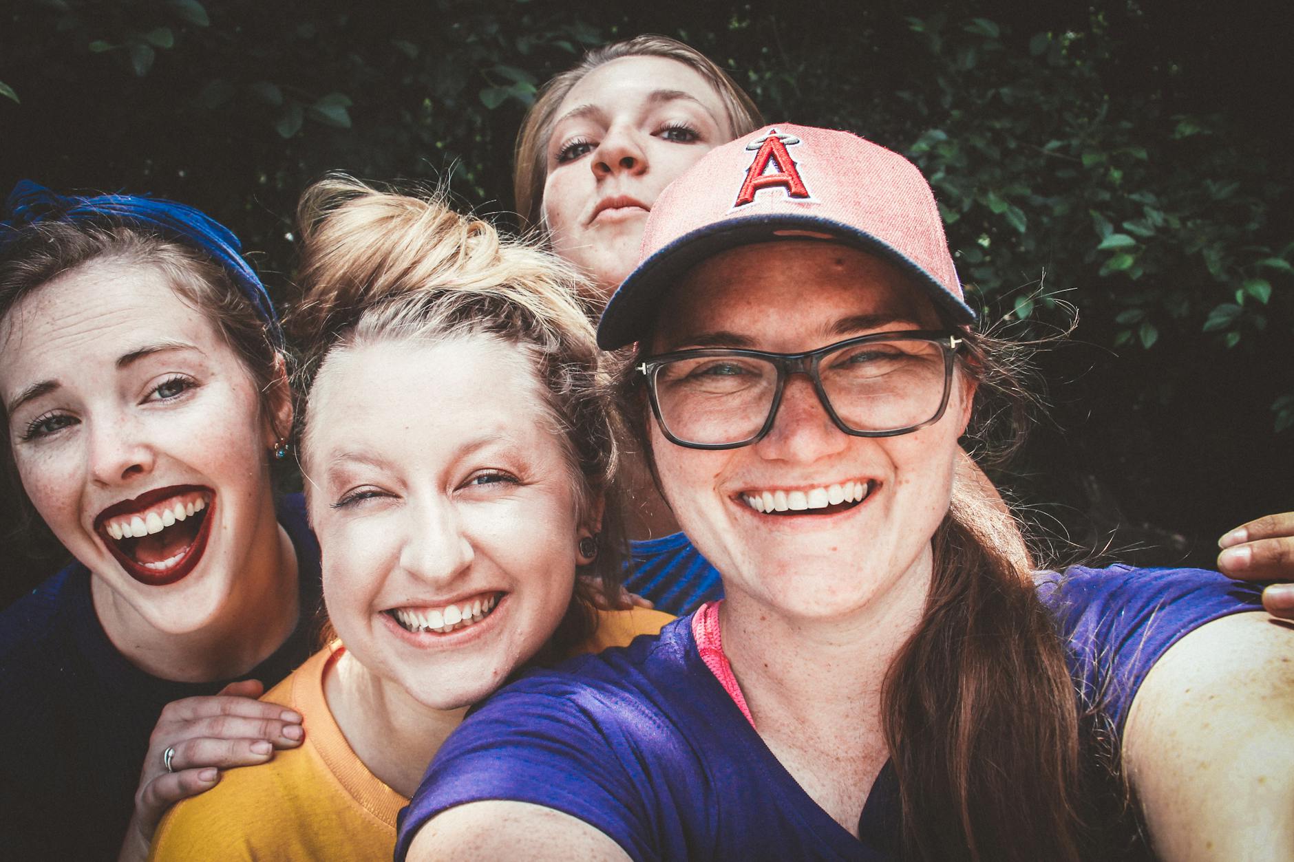 A joyful group of women taking a selfie outdoors, showcasing happiness and friendship. - spring break activities