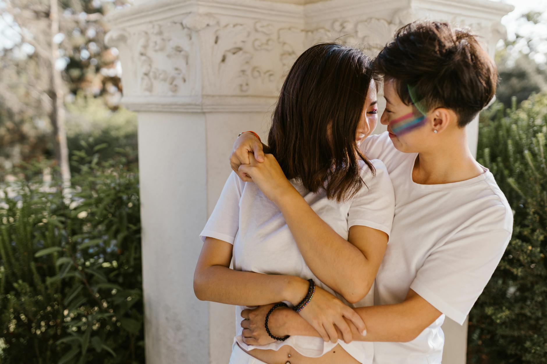 Happy lesbian couple embracing outdoors. Celebrating love and joy in natural surroundings. - spring relationship goals
