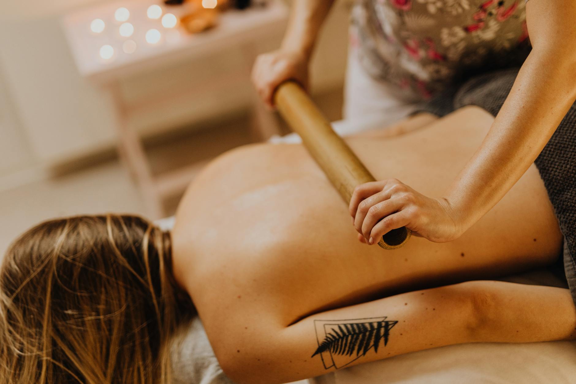 A serene indoor bamboo massage session capturing relaxation and stress relief. - virtual therapy benefits