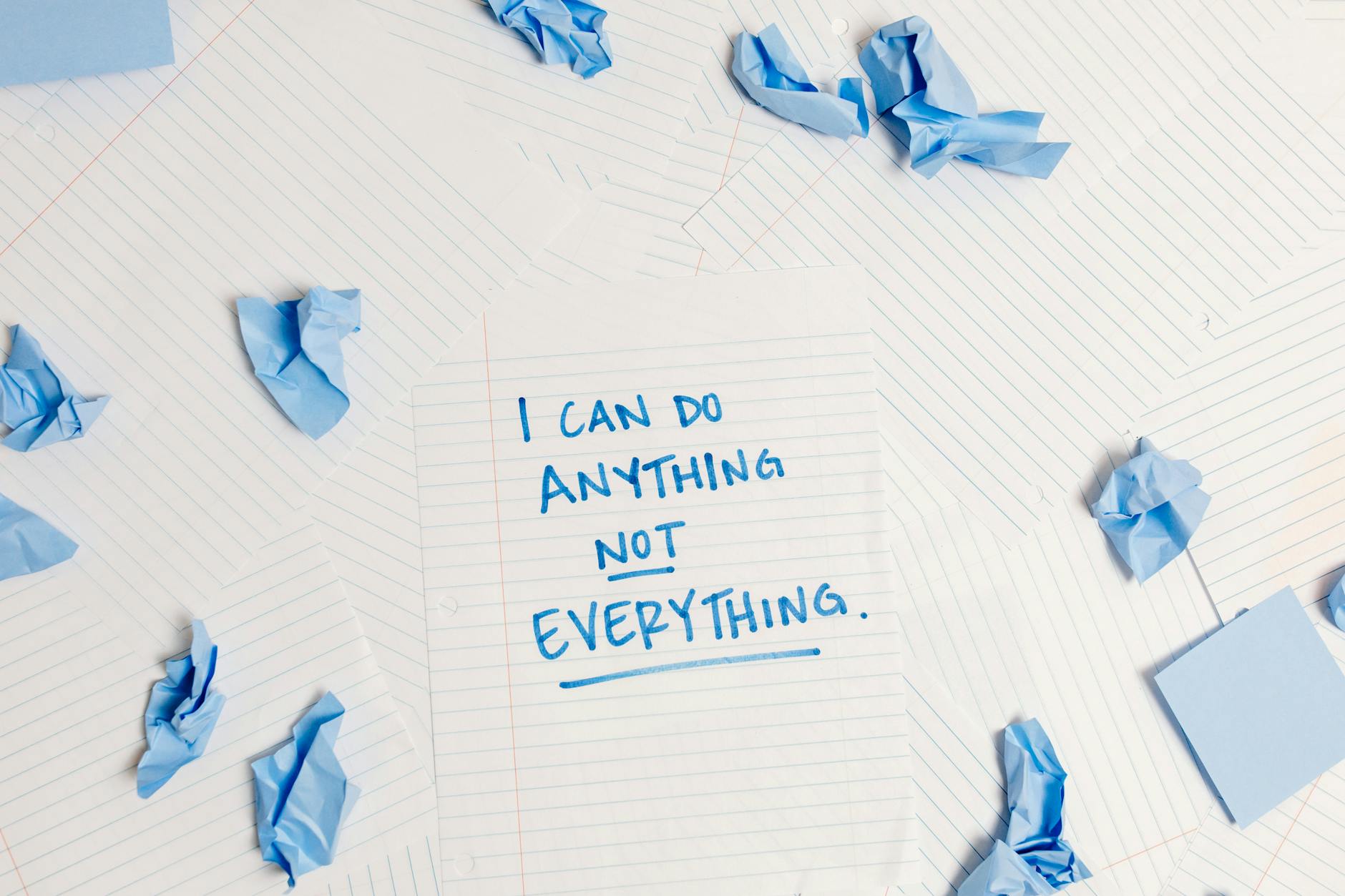 Inspirational message on a notepad surrounded by crumpled paper pieces. - bad apology examples