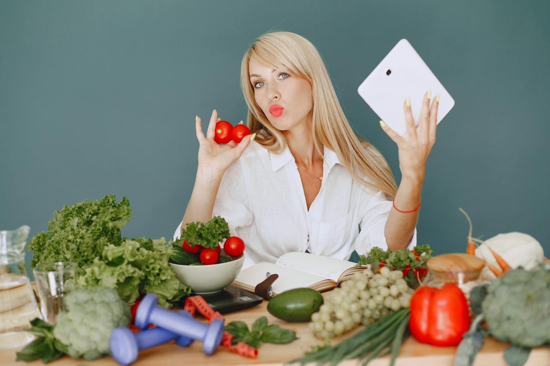Vlogger promoting healthy eating with fresh vegetables on the table. - diet for mental clarity
