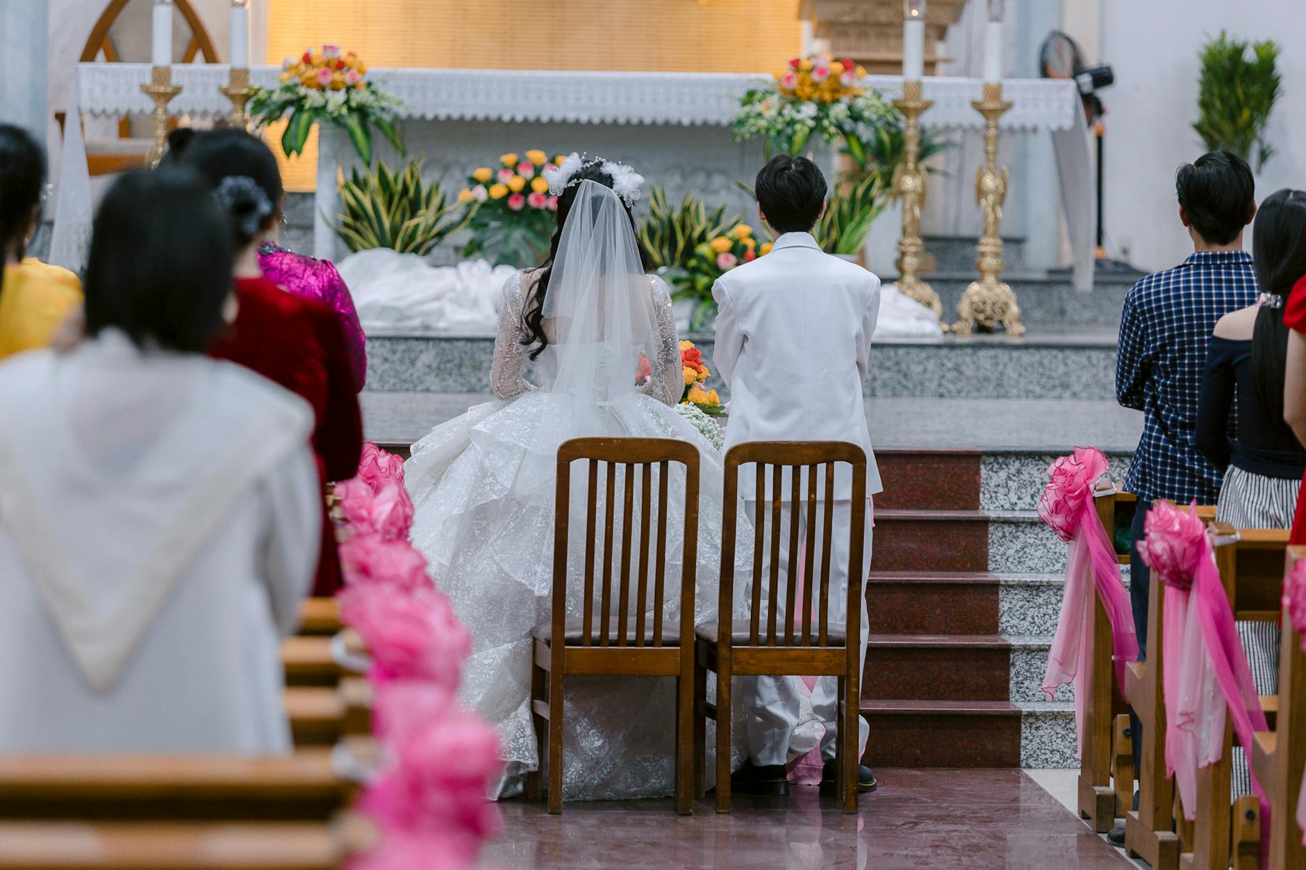 Bride and groom in traditional attire at a beautiful church wedding ceremony. - expressing needs marriage