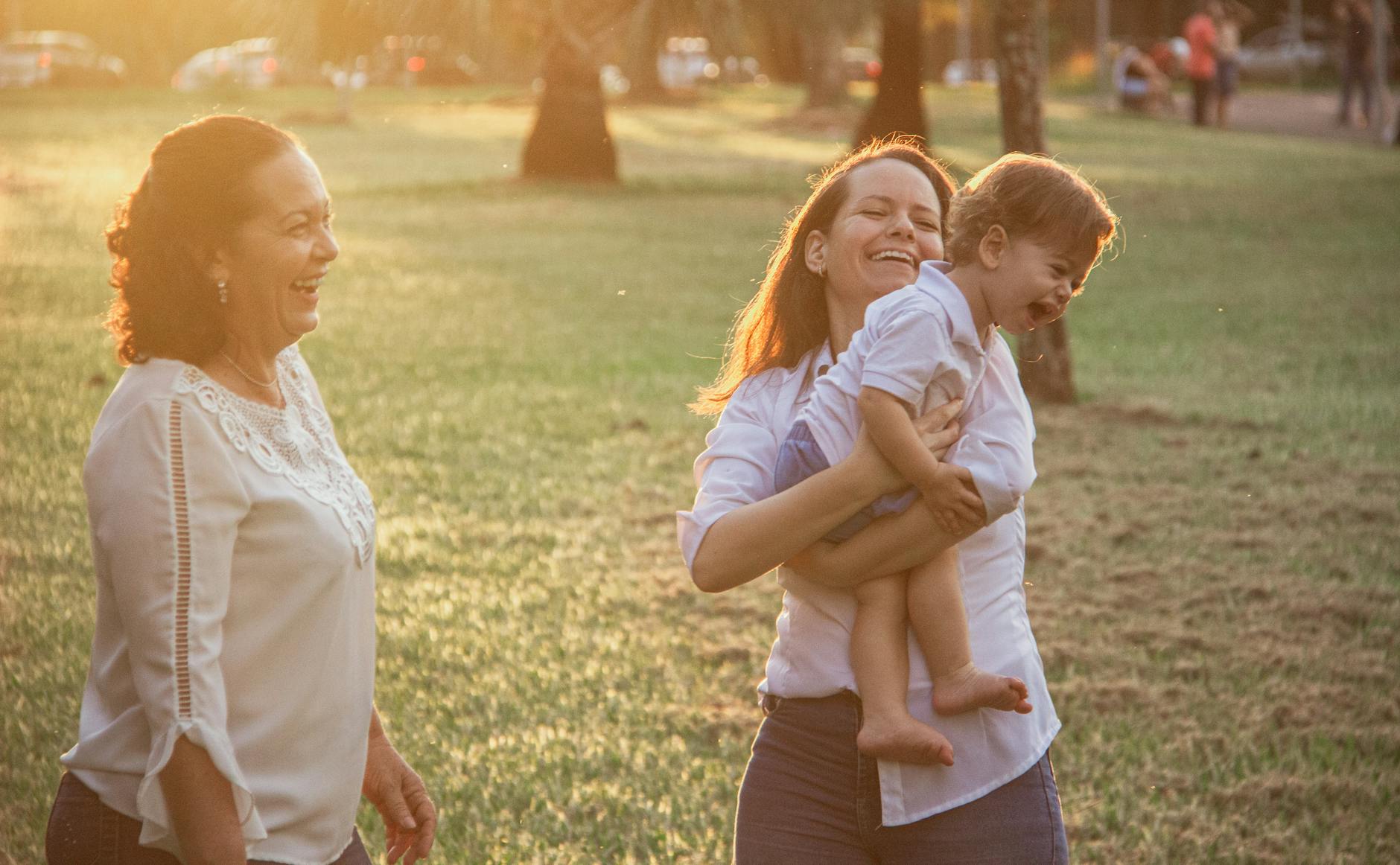 Happy family enjoying a walk in the park during sunset, capturing genuine joy and connection. - family therapy spring
